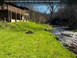 Lead image for 21027 Wayah Road, Topton, NC — a cabin on the banks of White Oak Creek